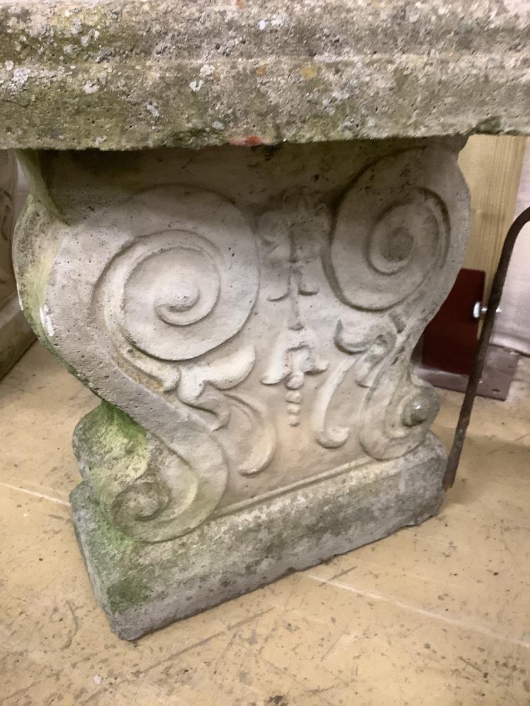 A reconstituted stone curved garden seat, length 110cm, depth 44cm, height 44cm